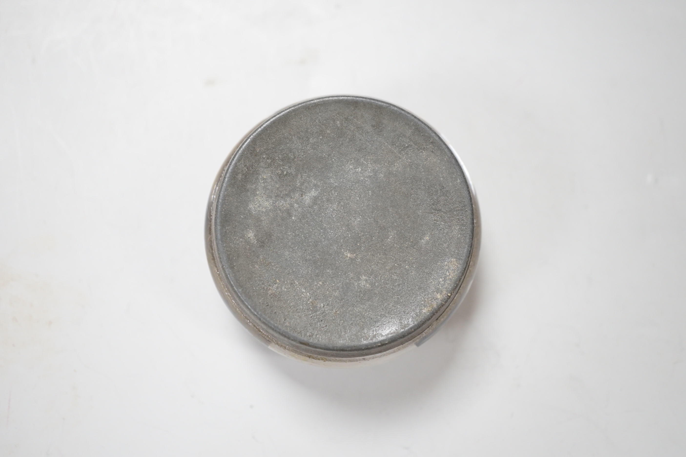 A pinchbeck figural paperweight, approximately 6cm diameter
